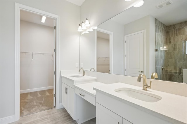 bathroom featuring vanity and an enclosed shower