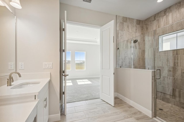 bathroom featuring vanity and walk in shower