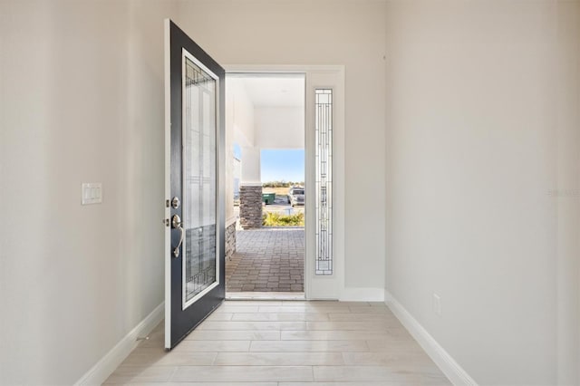 entryway with light hardwood / wood-style floors