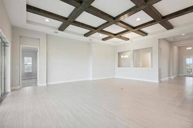 10426 Longmeadow Ave, Parrish, FL 34219 - spare room featuring a chandelier, coffered ceiling, beam ceiling, baseboards, and light wood-style flooring