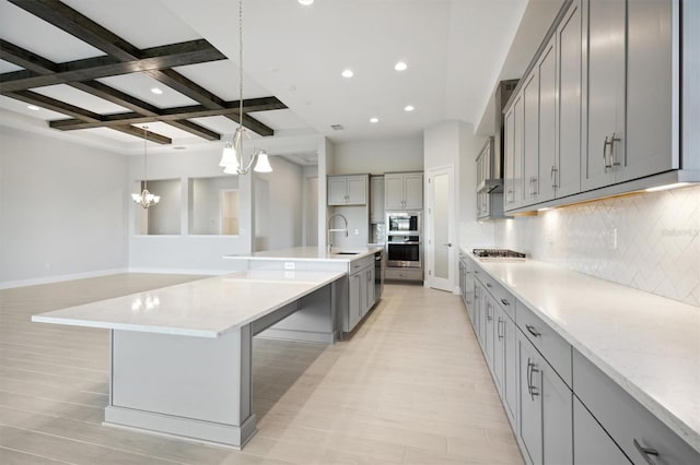 10426 Longmeadow Ave, Parrish, FL 34219 - kitchen with a chandelier, gray cabinets, a sink, decorative backsplash, and beam ceiling