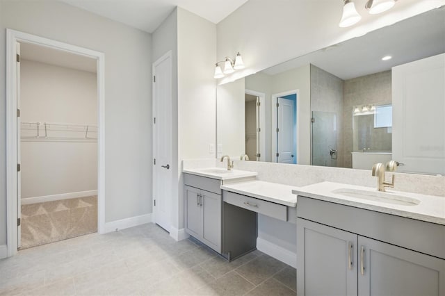 10426 Longmeadow Ave, Parrish, FL 34219 - full bathroom featuring double vanity, a shower stall, a spacious closet, and baseboards