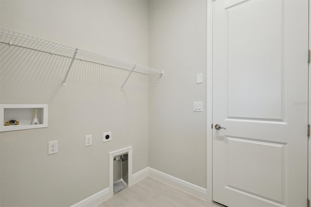 laundry area featuring washer hookup, light hardwood / wood-style flooring, and electric dryer hookup