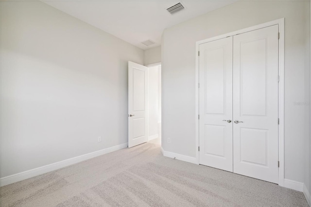 10324 Longmeadow Ave, Parrish, FL 34219 - unfurnished bedroom featuring carpet floors, a closet, and baseboards