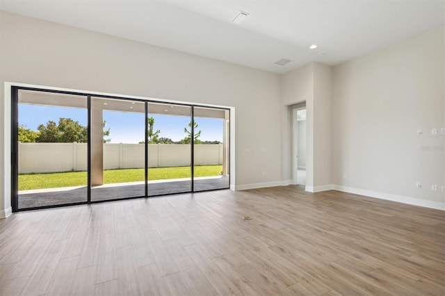 spare room featuring light hardwood / wood-style flooring