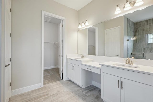 bathroom with vanity and an enclosed shower