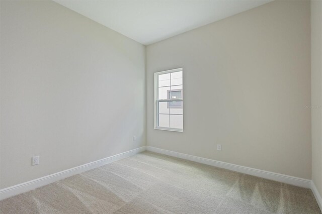 empty room featuring light carpet