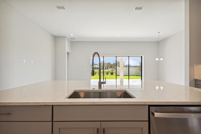 kitchen featuring gray cabinets, sink, dishwasher, and light stone countertops