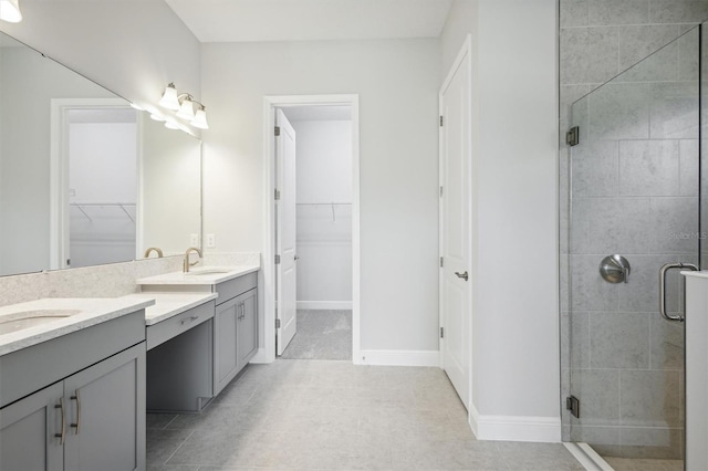 bathroom with vanity, tile patterned flooring, and an enclosed shower