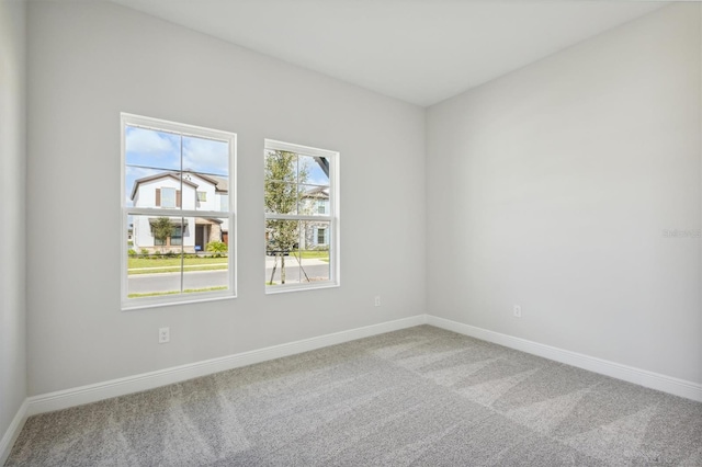 unfurnished room featuring carpet