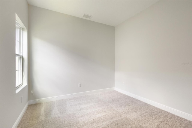 unfurnished room with carpet floors