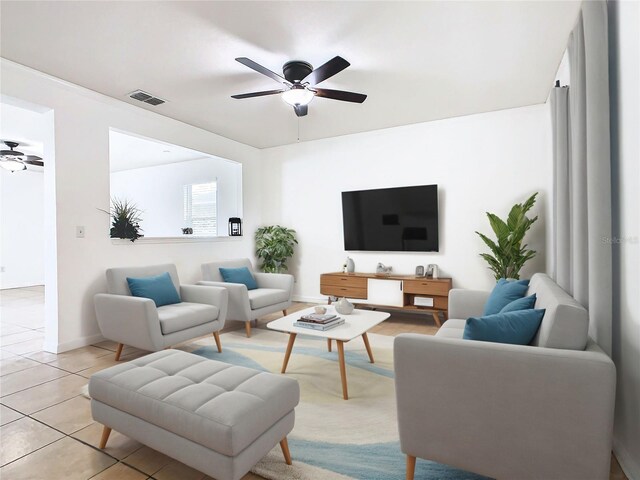 tiled living room featuring ceiling fan