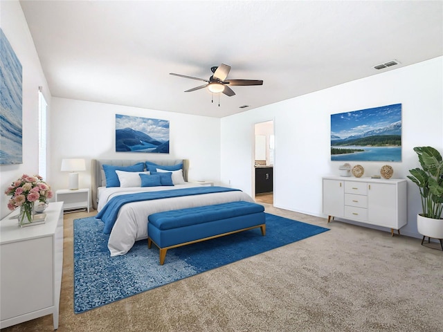 bedroom featuring ceiling fan, carpet floors, and ensuite bath