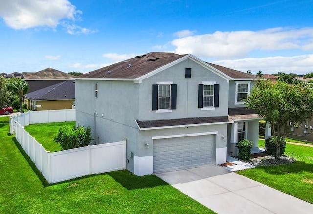 view of front of house with a front yard and a garage