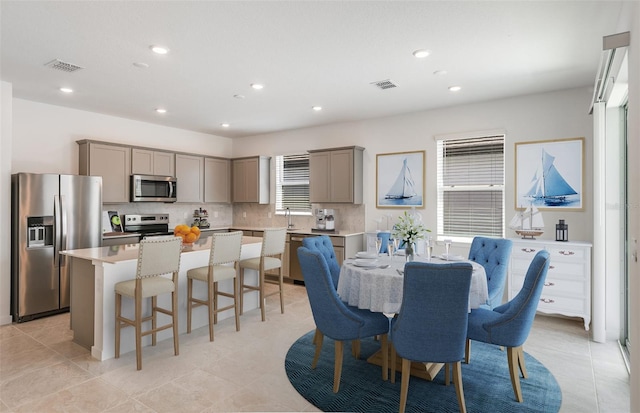 dining space with light tile patterned floors