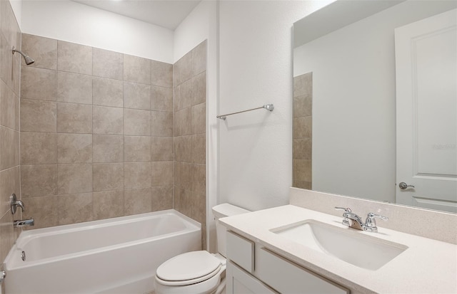 full bathroom with toilet, tiled shower / bath, and vanity