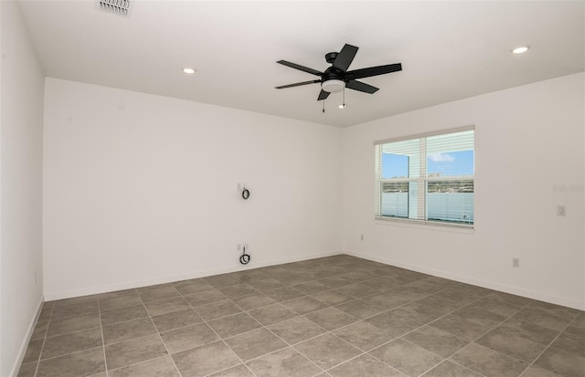 spare room with ceiling fan