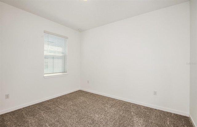 unfurnished room with carpet flooring