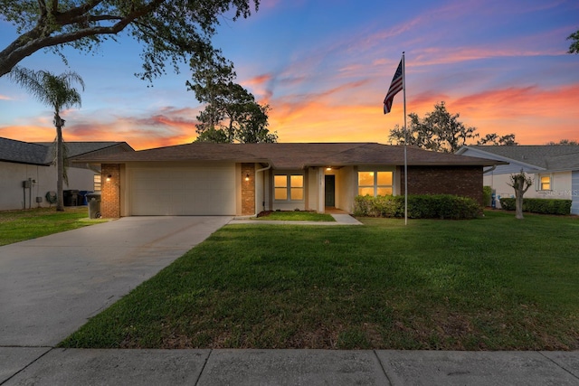 2618 Crestfield Dr, Valrico, FL 33596 - ranch-style home with brick siding, an attached garage, concrete driveway, and a yard