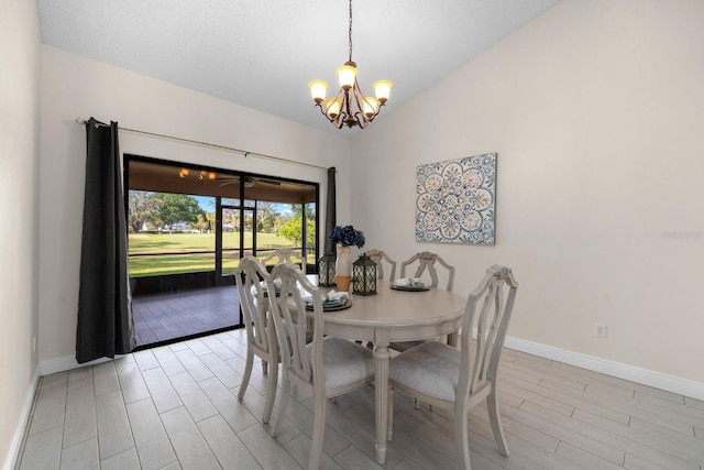 2618 Crestfield Dr, Valrico, FL 33596 - dining space featuring baseboards, a chandelier, wood finish floors, and lofted ceiling