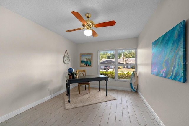 2618 Crestfield Dr, Valrico, FL 33596 - office featuring wood finished floors, ceiling fan, a textured ceiling, and baseboards