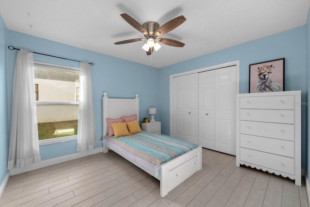 2618 Crestfield Dr, Valrico, FL 33596 - bedroom featuring light wood finished floors, baseboards, a closet, and a ceiling fan