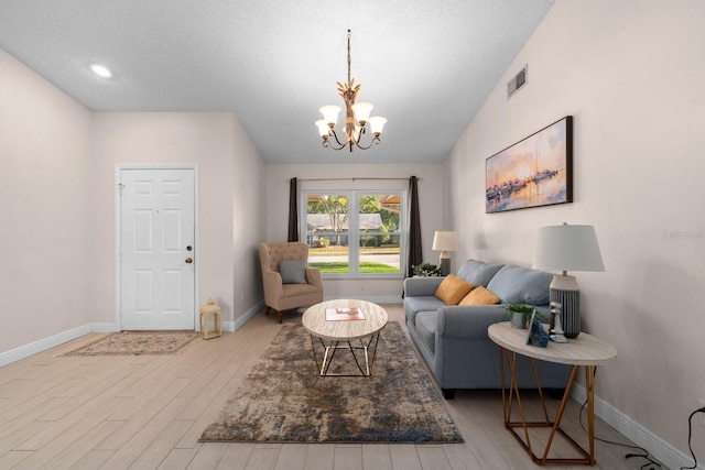 2618 Crestfield Dr, Valrico, FL 33596 - living room featuring a chandelier, wood finished floors, and baseboards