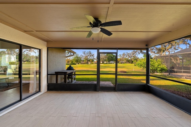 2618 Crestfield Dr, Valrico, FL 33596 - unfurnished sunroom featuring a ceiling fan and view of golf course