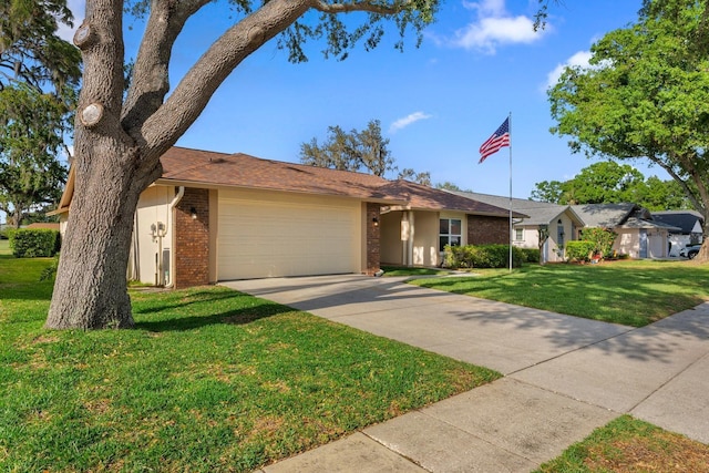 2618 Crestfield Dr, Valrico, FL 33596 - view of front of house with brick siding, a garage, a front yard, and concrete driveway