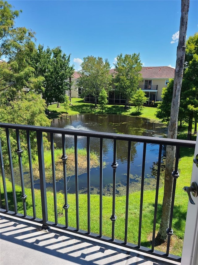 balcony featuring a water view