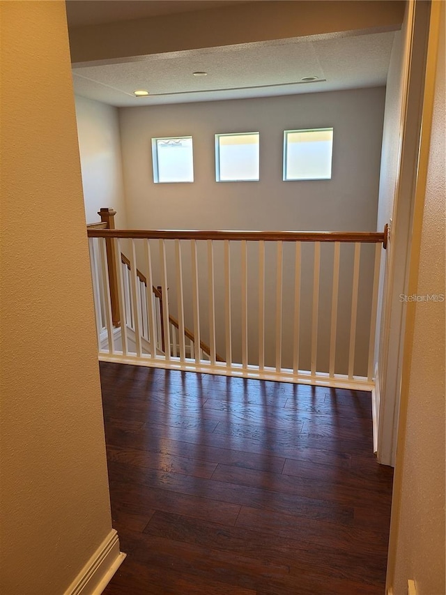 spare room with dark hardwood / wood-style flooring