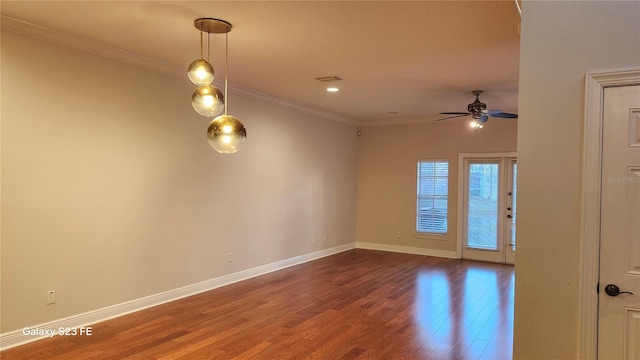 spare room with wood-type flooring, ornamental molding, and ceiling fan