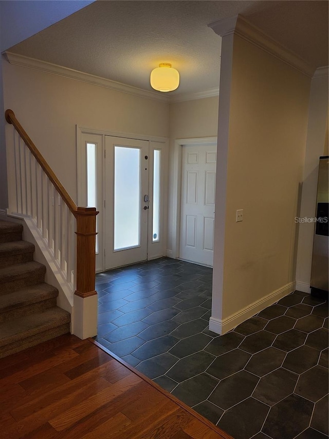 foyer entrance featuring dark hardwood / wood-style flooring and ornamental molding