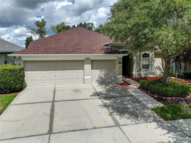 view of front of property with a garage