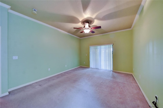 carpeted empty room with ornamental molding and ceiling fan