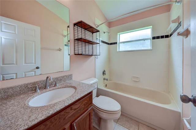 full bathroom with lofted ceiling, tiled shower / bath combo, vanity, tile patterned floors, and toilet