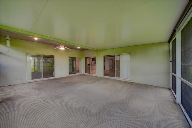 view of patio featuring ceiling fan