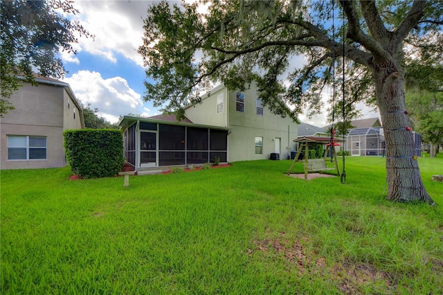 view of yard featuring a sunroom