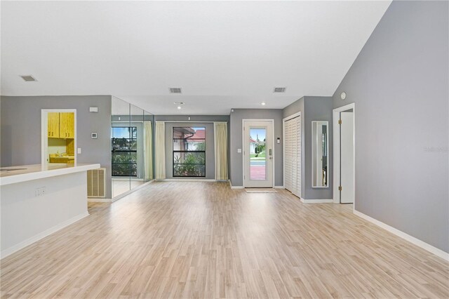 unfurnished living room featuring light hardwood / wood-style flooring