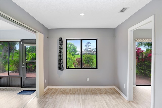 empty room featuring light hardwood / wood-style floors