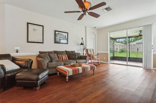 living room featuring ceiling fan and hardwood / wood-style flooring