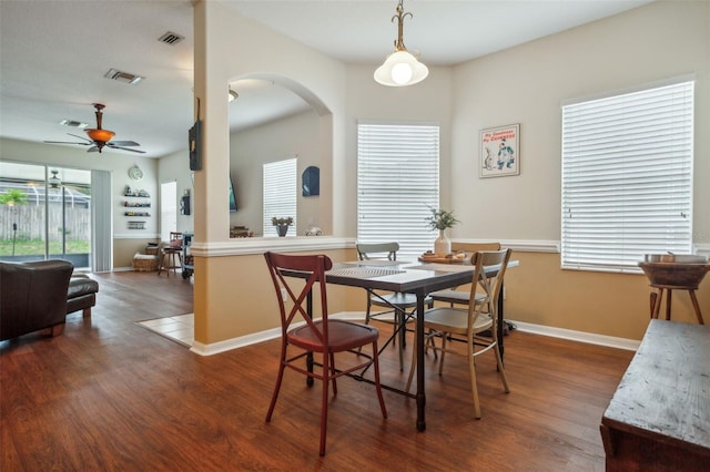 dining room featuring ceiling fan and dark wood-type flooring