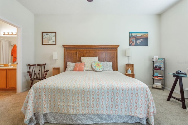 carpeted bedroom with ensuite bathroom