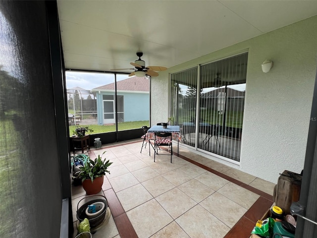 sunroom / solarium with ceiling fan