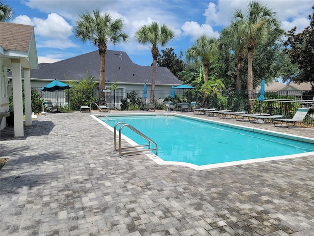 view of swimming pool featuring a patio area