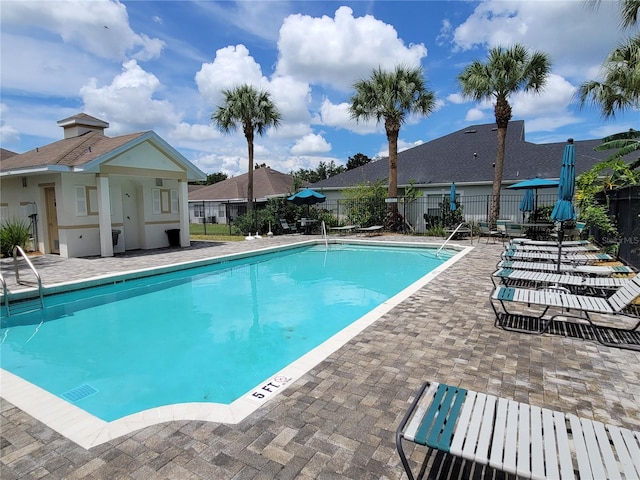 view of pool featuring a patio