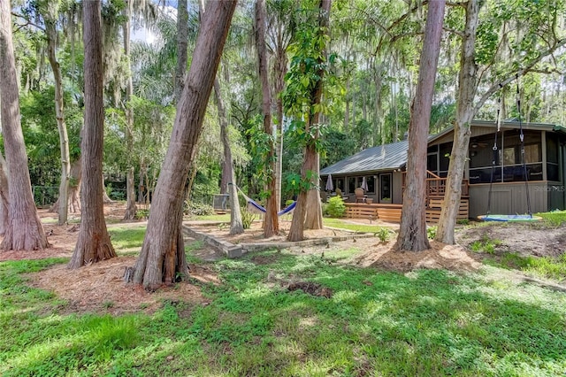 view of yard featuring a sunroom