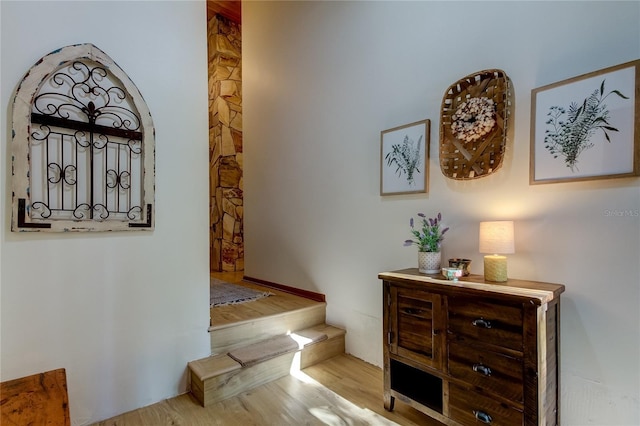 hall with light hardwood / wood-style floors