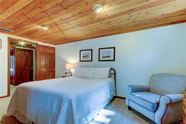 carpeted bedroom with wood ceiling