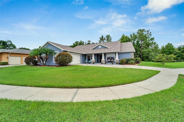 single story home featuring a garage and a front yard